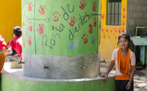 Students show great pride for their beautifully decorated hand washing and tooth brushing station.