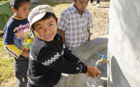 Some of the students washing their hands. Lynn Roberts, head of APLS, is in the background with other students.